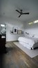 The master bedroom is a clean but cozy space filled with plenty of light from the clerestory windows. Photo 7 of Modern Courtyard Home modern home