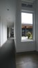 The windows along the hallway prevent it from feeling too narrow or gloomy. The space transforms into an elegant stretch of space filled with light and becomes much more than just a utilitarian hallway. Photo 8 of Modern Courtyard Home modern home