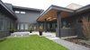 The back of the house has an all grey exterior that lets the modern design speak for itself. Photo 10 of Modern Courtyard Home modern home