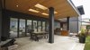 The covered patio and built-in barbecue make the backyard perfect for outdoor living. Photo 11 of Modern Courtyard Home modern home