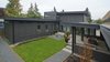 The backyard is designed to take advantage of the abundant space and allows for plenty of outdoor living throughout the year in the beautiful Pacific Northwest. Photo 12 of Modern Courtyard Home modern home