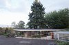 In response to the demand to live harmoniously with nature and community, the Courtyard House is conceived as a canopy structure: a single volume framed between a cantilevered concrete slab below and a roof “umbrella” above. Photo 4 of The Courtyard House modern home