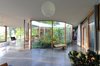 Because no room is compartmentalized and isolated as in a conventional home, every room can be an active space during the day and a sleeping space at night. Photo 11 of The Courtyard House modern home