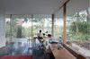 Maximizing usable space while minimizing poché, each storage core contains all of the rituals of daily living—toilets, showers, closets, mechanicals, and kitchen—allowing each room to be equipped communally when open or privately when closed. Photo 12 of The Courtyard House modern home