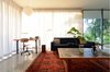 A continuous curtain track changes spaces from open to closed. Photo 13 of The Courtyard House modern home