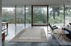 A series of cantilevered roof beams, supported by 3” diameter pipe columns, create a canopy structure. Photo 19 of The Courtyard House modern home