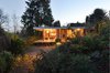 Like an outstretched umbrella, the canopy structure creates an open gesture for greater social conviviality, while at the same time, invites the natural world in. Photo 20 of The Courtyard House modern home
