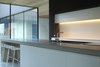 Open kitchen with view to the atrium and cherry trees Photo 2 of Karhusaari modern home