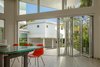 Modern home with Back Yard and Dining Room. Open floor plan, house around a patio, large windows and glass doors and a sense of outdoors in the indoor (Eichler principle). Photo 2 of Contemporary Eichler Offspring