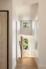 Modern home with Hallway and Light Hardwood Floor. Corridor connecting upper and lower level of the house. Photo 8 of Skyline to the Sea House