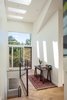 Modern home with Hallway and Light Hardwood Floor. Light moves along the wall as the day progresses. Photo 10 of Skyline to the Sea House