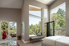 Master bedroom with large views. Photo 11 of Skyline to the Sea House modern home