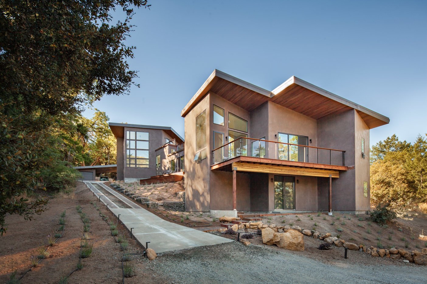Volumes of the structure descend down the hill.