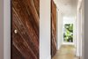 Modern home with Hallway and Light Hardwood Floor. Reclaimed wood barn-doors Photo 9 of Skyline to the Sea House