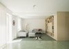 Modern home with Shelves, Storage, Bookcase, Sofa, and Cement Tile Floor. living room Photo 13 of Haus Mai