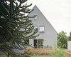 Modern home with Outdoor, Front Yard, Wood Patio, Porch, Deck, Trees, Decking Patio, Porch, Deck, and Garden. new street facade Photo 6 of Haus Mai