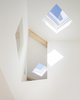 Modern home with Windows, Skylight Window Type, Wood, and Metal. double height space above dining table Photo 7 of Haus P