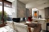 Living room again at a different angle with the fireplace visible Photo 10 of The Floating House modern home