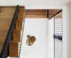 Modern home with Metal Tread, Wood Tread, Metal Railing, Living Room, Pendant Lighting, and Ceiling Lighting. Staircase - Rue de l'Espéranto residence - Guillaume Sasseville & PARKA - Architecture & Design Photo 12 of Rue de l'Espéranto residence