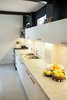 Marble countertop, granite floors, white furniture and wooden details. Photo 3 of Artigas modern home