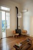 The living room preserves the original wooden floors and entrances Photo 8 of Artigas modern home