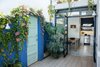 The patio at the front offers a view to the dining area and kitchen.
It has been painted in blue , which highlights the antique floor. Photo 9 of Artigas modern home