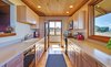 Galley Style Kitchen with Views and Lots of Counter Space Photo 9 of Idyllic Lopez Island Bayfront Home modern home