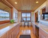 Large Windows Take in Bay Views in the Kitchen Photo 7 of Idyllic Lopez Island Bayfront Home modern home