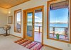 French Doors to 2nd Level Deck Overlooking Fisherman Bay Photo 14 of Idyllic Lopez Island Bayfront Home modern home