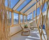Atrium Sitting Area with Double Sided Propane Fireplace Photo 13 of Idyllic Lopez Island Bayfront Home modern home