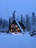 Modern home with Exterior, Metal Roof Material, Wood Siding Material, A-Frame RoofLine, Cabin Building Type, House Building Type, and Beach House Building Type. Kyst Hus - front and side profile of the cabin. Photo 5 of Kyst Hus A Frame