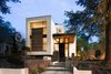 Modern home with Trees, Front Yard, Exterior, Wood Siding Material, and Stucco Siding Material. Landscape design by West Architecture Studio. Planting design by Brendan Butler Photo of Alaska House