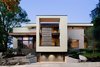 Side street elevation. The lower level of this large rectangular frame is a large cantilevered planter. See also dining room from inside. Photo 2 of Alaska House modern home