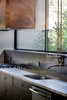 Custom copper vent hood and kitchen faucet Photo 7 of Pyrite House modern home