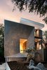 Modern home with Exterior, House Building Type, Wood Siding Material, Stucco Siding Material, and Stone Siding Material. All landscapes look better with big rocks. Nice work Brendan Butler Landscapes Photo 3 of Tesseract House