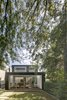 Modern home with Outdoor, Back Yard, Trees, Shrubs, Walkways, and Grass. The rear of the house opens to the garden, creating a layering of spaces from inside to out. Photo 2 of Inner West House