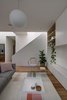 Modern home with Living Room, Sofa, Chair, Coffee Tables, Bookcase, Ceiling Lighting, and Medium Hardwood Floor. Colourful furnishings animate the space. Thonet armchair, Jardan Nook lounge and Hay side tables provide a comfortable, deliberately low key setting. Photo 4 of Inner West House