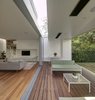 A second skylight cuts across the garden room, bringing soft natural light into the interior and providing balanced light to both sides of the garden room. Photo 9 of Inner West House modern home