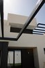 Modern home with Outdoor and Back Yard. Perogolas, volúmenes de planta superior desde el patio. Photo 4 of CASA FLORES