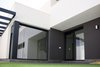 Modern home with Outdoor, Back Yard, Small Patio, Porch, Deck, Stone Patio, Porch, Deck, Garden, and Grass. Cristalera de acceso al patio. Photo 5 of CASA FLORES