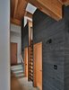 Modern home with Hallway and Concrete Floor. Hall with loft ladder Photo 13 of Nelson Preserve Family Retreat