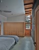 Modern home with Bedroom, Bed, Wardrobe, Ceiling Lighting, and Concrete Floor. Master Bedroom Photo 9 of Nelson Preserve Family Retreat