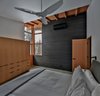 Modern home with Bedroom, Bed, Wardrobe, Ceiling Lighting, Wall Lighting, and Concrete Floor. Master Bedroom Photo 7 of Nelson Preserve Family Retreat
