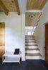 Modern home with Staircase, Metal Tread, Wood Tread, and Metal Railing. The staircase connects the ground floor corridor to the second floor. The small walkway separates the master privates appartement from the rest of the house. Photo 4 of L'Eau Vive