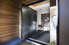 Steel pivot entry door Photo 10 of Hawthorne Residence modern home