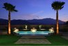 Sunset view of pool and San Jacinto mountain range Photo 2 of Whispering Wind modern home