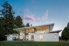 View side of the Lake House with multiple outdoor living choices. Photo of The Lake House modern home