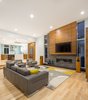 Open living and fireplace Photo 7 of Evergreen Pointe House modern home