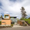 Modern home with Exterior, House Building Type, Wood Siding Material, and Metal Siding Material. Front street side elevation Photo 3 of Panavista Hill House
