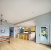 Modern home with Kitchen, Quartzite Counter, Wood Counter, Colorful Cabinet, Medium Hardwood Floor, Pendant Lighting, and Recessed Lighting. Living / dining / kitchen Photo 6 of Panavista Hill House